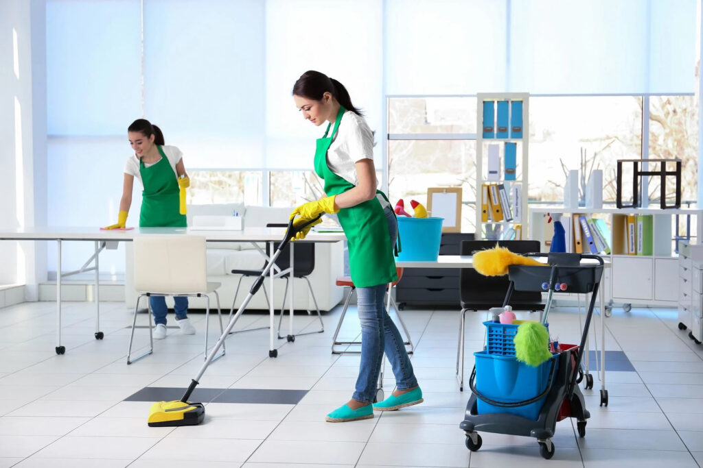 Office cleaning team mopping and wiping desks in Campbell, CA